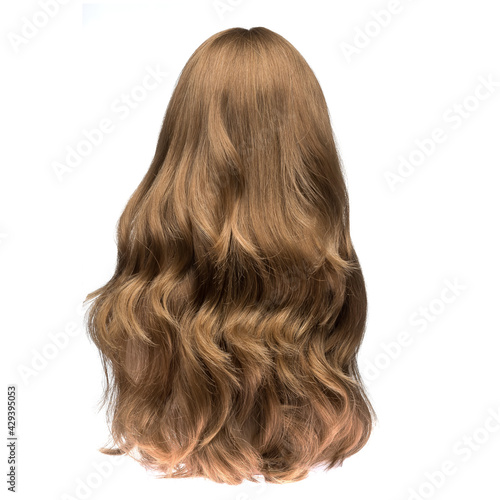 Human hair wig on a mannequin. Back view. Brunette. Wavy hair