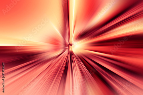Abstract radial zoom blur surface of red, pink and yellow tones. Abstract pink and yellow background with radial, radiating, converging lines. 