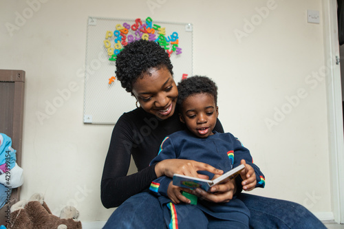 Parent and child reading a story together 