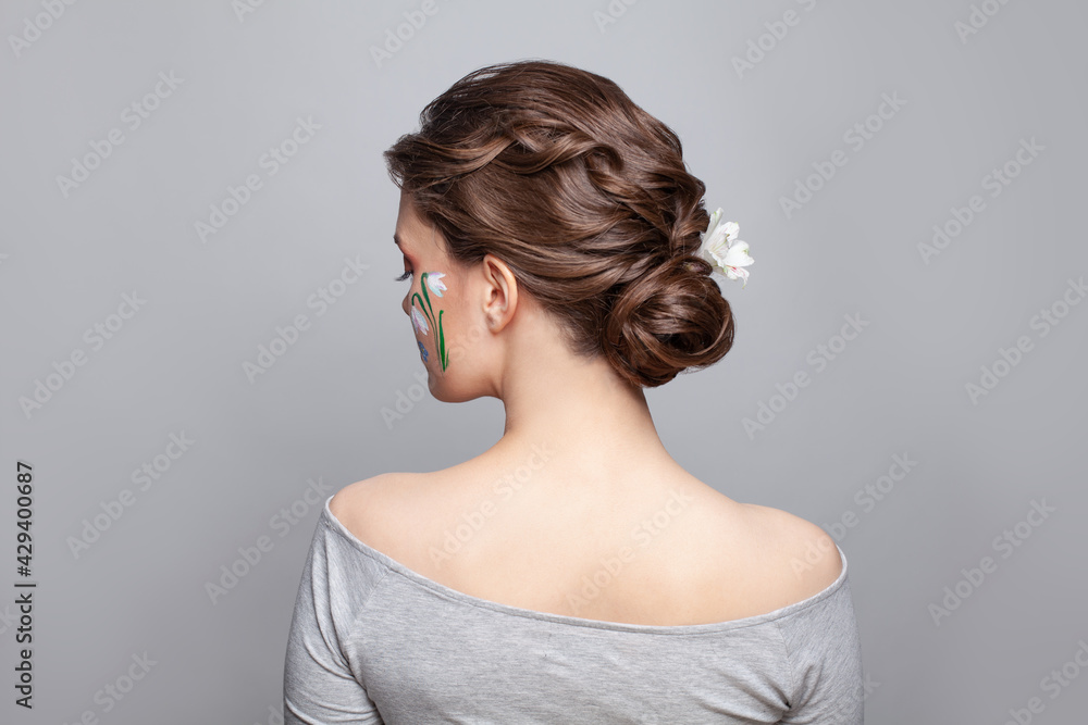 Pretty brunette woman back and head with perfect hairdo on white background Pretty brunette woman back and head with perfect hairdo on white background
