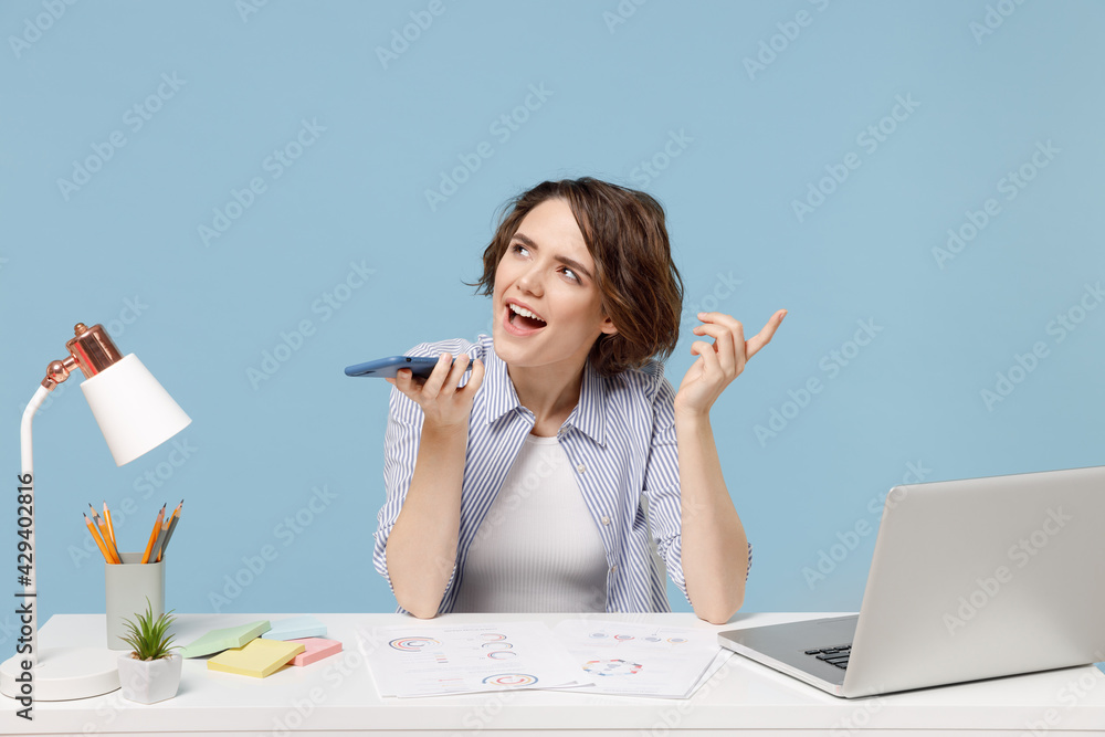 Young secretary employee business woman 20s in casual shirt sit work at ...