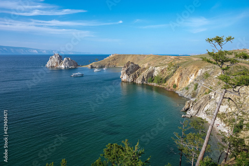 Rocky bay with clear blue water and yachts. Stone island. Unique nature of Olchon island photo