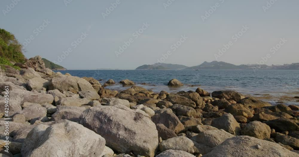 Rock and stone beach with blue sky Rock and stone beach with blue sky