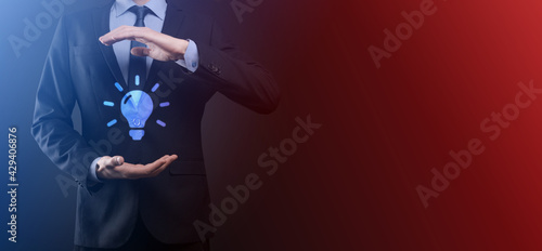 Hand holding light bulb. Smart idea icon isolated. Innovation, solution icon. Energy solutions. Power ideas concept. Electric lamp, technology invention. Human palm. Business inspiration. © Ivan