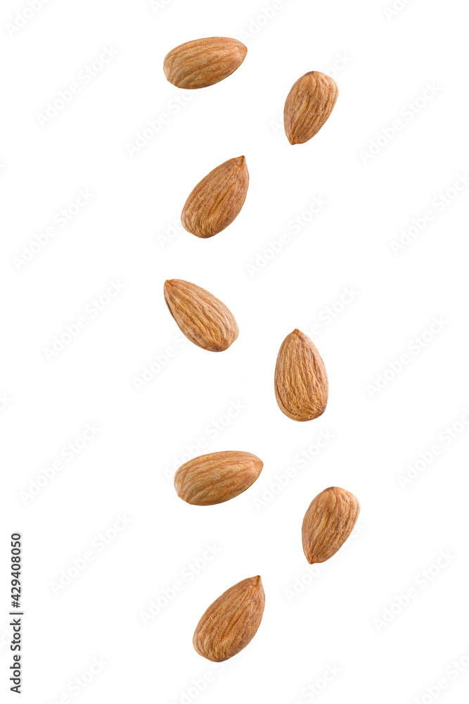 Tasty almonds falling isolated on a white background Tasty almonds falling isolated on a white background