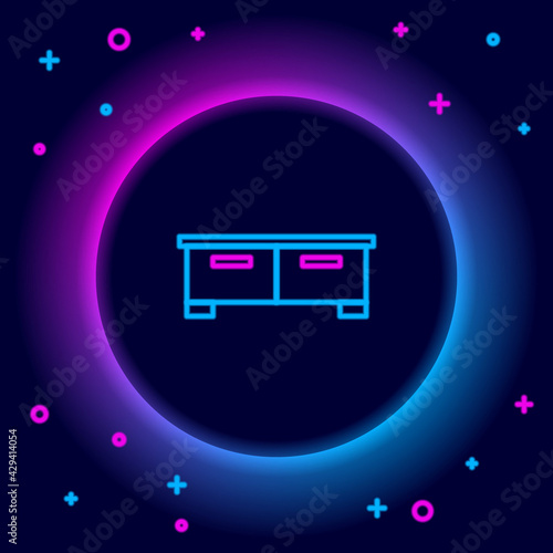 Glowing neon line Chest of drawers icon isolated on black background. Colorful outline concept. Vector