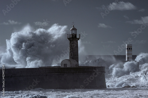 Storm at the Douro mouth north beacon and pier