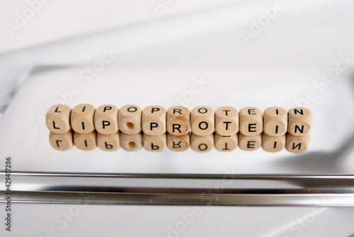 Word lipoprotein made by wooden cubes with reflection photo