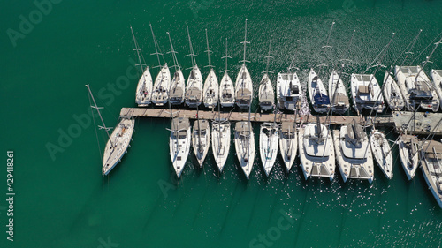 Aerial drone photo of beautiful Marina of Alimos with many luxury yachts and sail boats anchored, Athens riviera, Attica, Greece photo