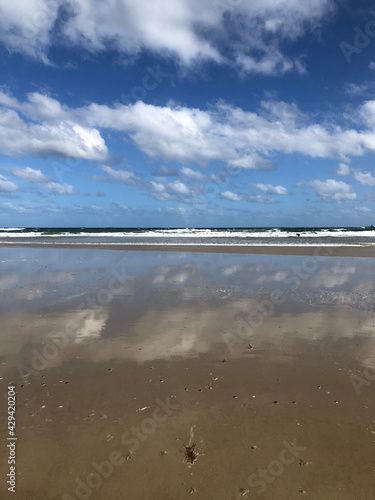 Clouds reflected on beach horizon at Phillip Island, Melbourne, Australia