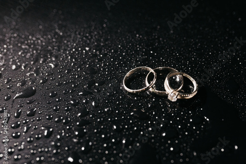 wedding rings on a glass