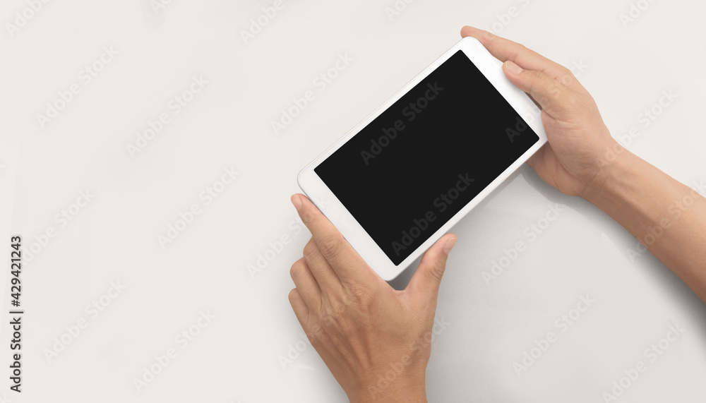 Hands holding tablet touch computer gadget