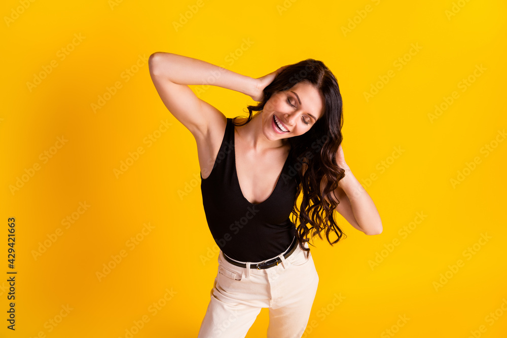 Top above high angle view photo of young girl happy smile enjoy news haircare shampoo isolated over yellow color background Top above high angle view photo of young girl happy smile enjoy news haircare shampoo isolated over yellow color background