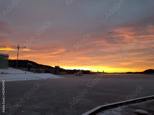 sunset by the docks in the city in the winter