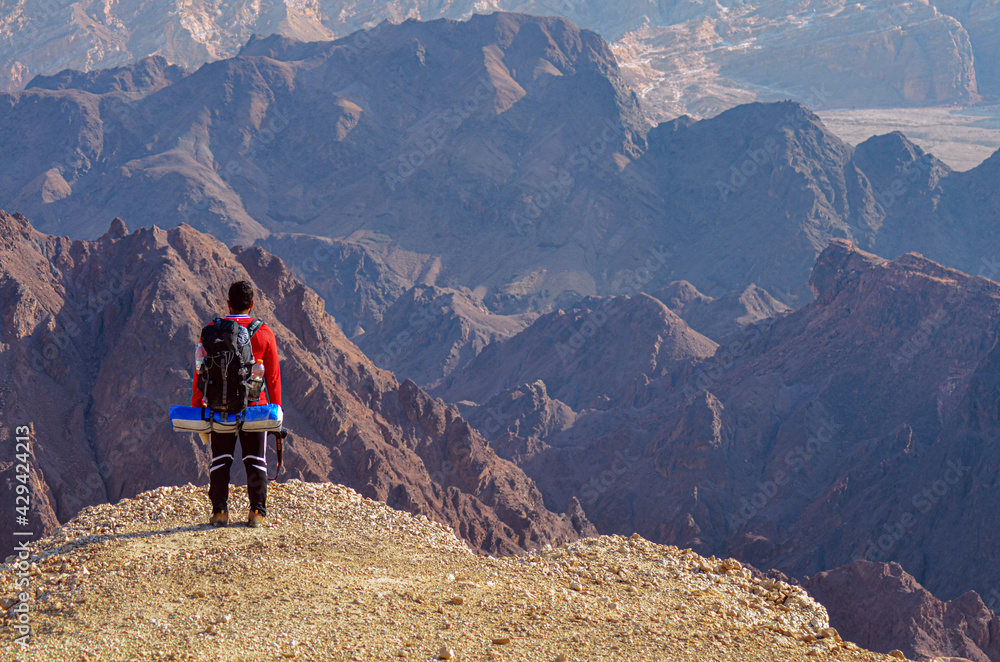 Fototapeta premium hiking in the mountains, hiker, photographer
