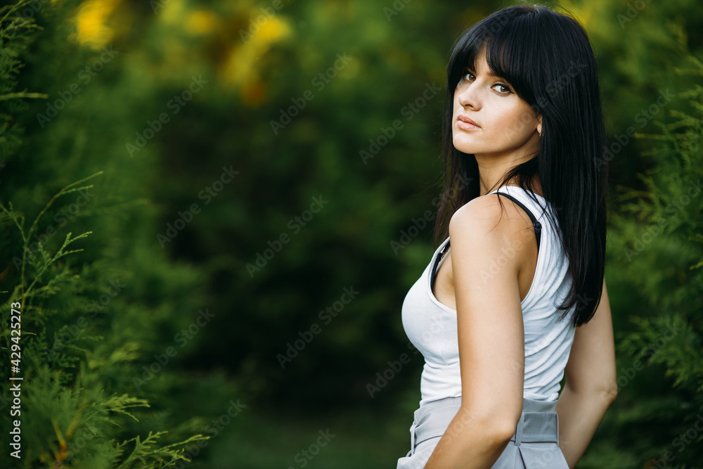 Close-up portrait of a young beautiful woman, over green background. Copy space Close-up portrait of a young beautiful woman, over green background. Copy space