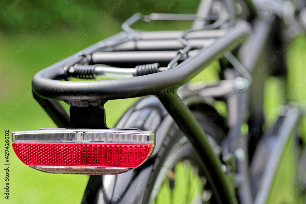 Close-up of red reflector back on a bicycle Close-up of red reflector back on a bicycle