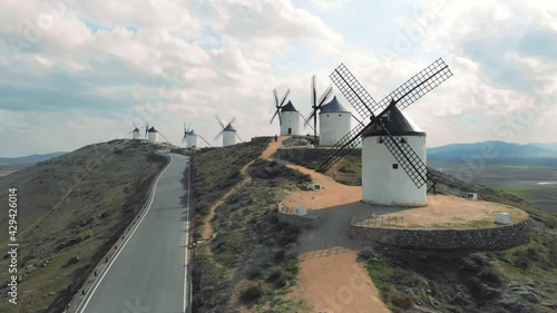 Drone point of view famous windmills in Consuegra town, symbol of Castilla-La Mancha, some windmills still work since their manufacture. History and heritage in Toledo concept. Europe, Toledo. Spain
 photo