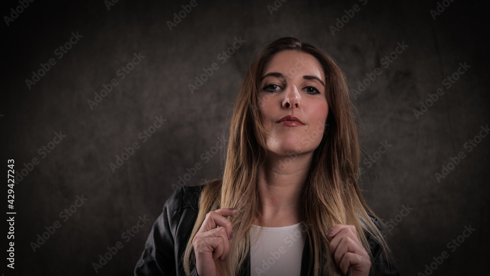Close-up shot of a young attractive woman in her mid 20s - studio photography