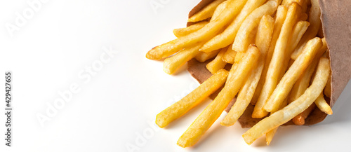 Appetizing french fries on white background. Hot fast food. Place for text.