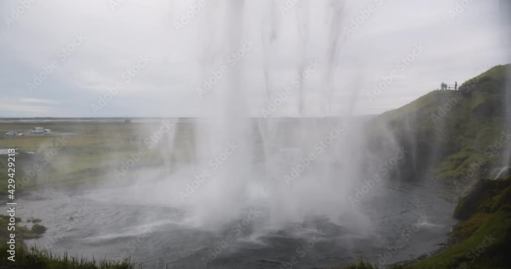 Falling water from Seljalandsfoss waterfall in Iceland, slow motion Falling water from Seljalandsfoss waterfall in Iceland, slow motion