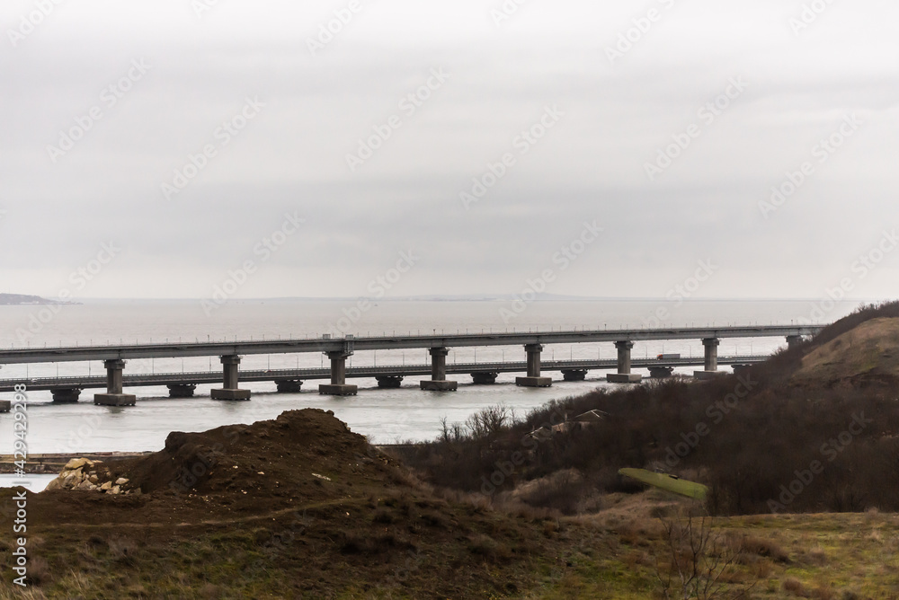 The Crimean Bridge in Kerch. Evening view of the beginning of the bridge. Kerch Strait from the Crimea.