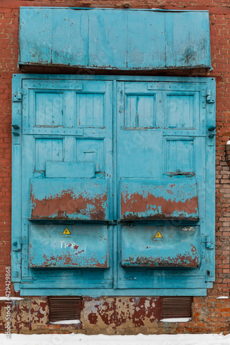 Doors and gates of an electrical substation. Blue gate. 