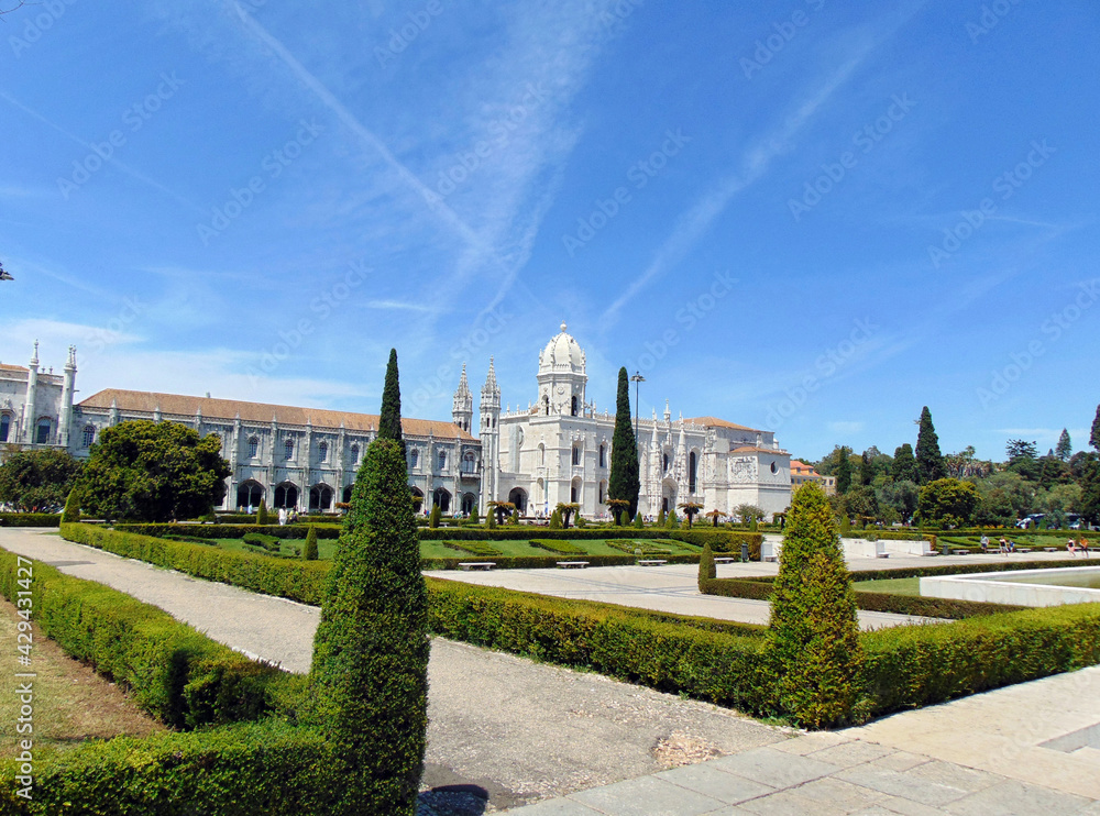 View of the Jeronimos monastery and the park on a fine June day View of the Jeronimos monastery and the park on a fine June day