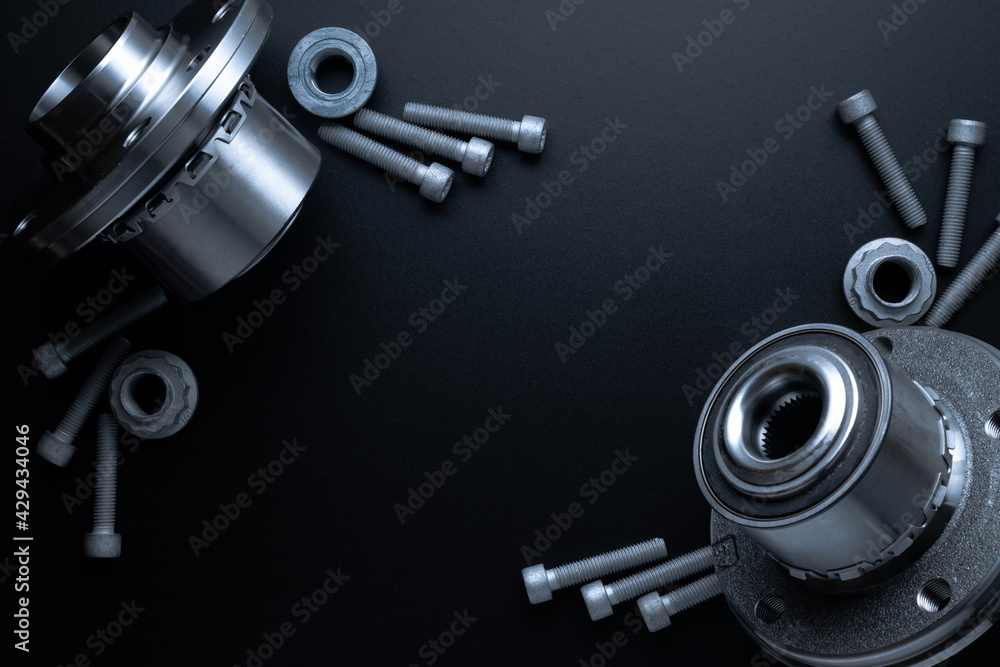 Car motor parts. Auto motor mechanic spare or automotive piece on dark background. Set of new metal car part. Flat lay, top view, copy space. Car motor parts. Auto motor mechanic spare or automotive piece on dark background. Set of new metal car part. Flat lay, top view, copy space.