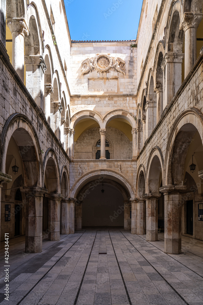 Stone arches decorate the Sponza palace inside the old town of Dubrovnik Croatia