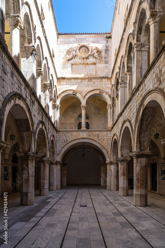 Stone arches decorate the Sponza palace inside the old town of Dubrovnik Croatia © rudiernst