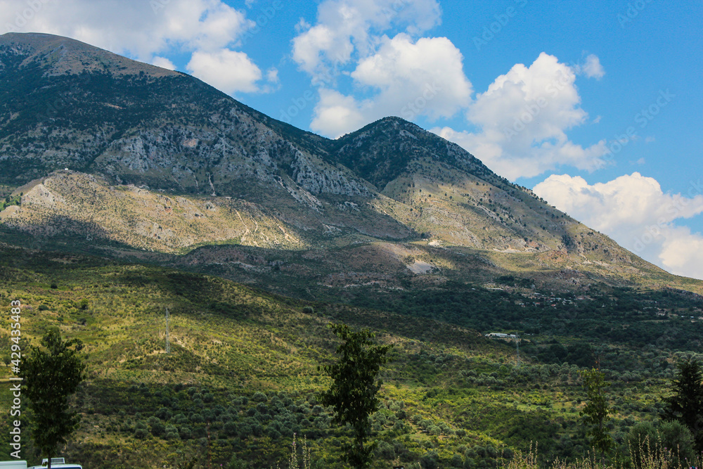 Typical European landscape green mountains clouds 