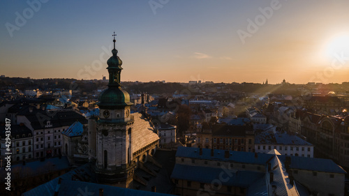 aerial view of sunset above old european city. church bell tower