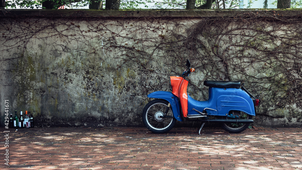Simson Schwalbe moped in front of a wall Stock Photo | Adobe Stock