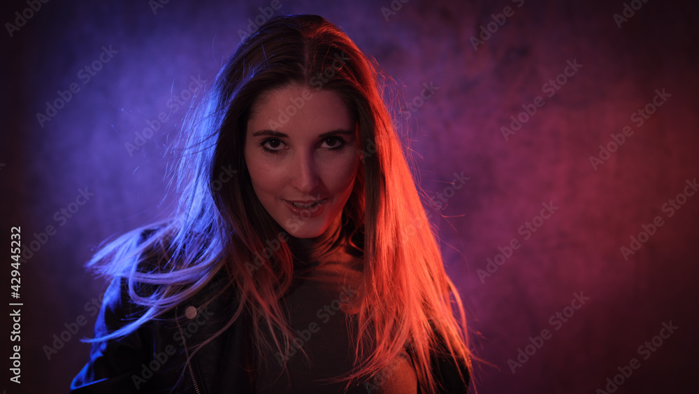 Funky colorful fashion portrait of a young blonde woman - studio photography