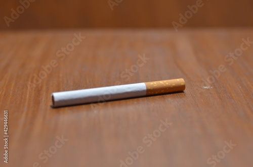 Close-Up Of several Cigarette on wooden background