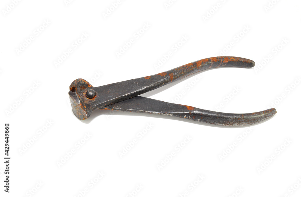 Rusty steel pliers on a white background close-up. Tools, wire cutters Rusty steel pliers on a white background close-up. Tools, wire cutters