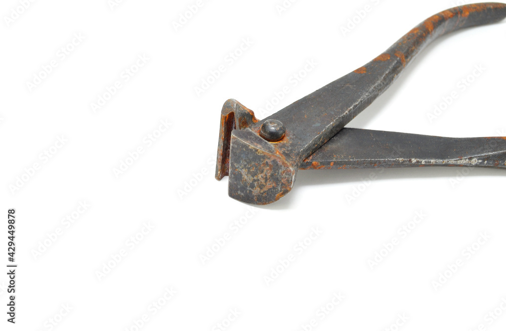 Rusty steel pliers on a white background close-up. Tools, wire cutters Rusty steel pliers on a white background close-up. Tools, wire cutters