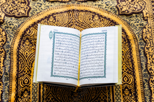 Black Muslim Woman studying quran photo