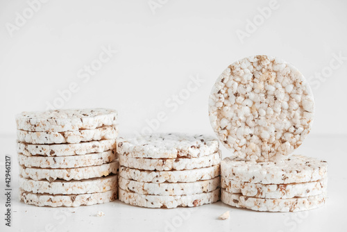 Round diet crispbreads on a white background. Round shaped cereal bread, healthy food without yeast. Copy, empty space for text
