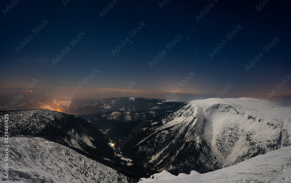 night view at mountains during winter with stars sky in Krkonose mountain in Czech republic