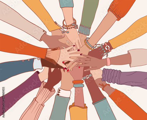 Group of arms and hands on top of each other in a circle of diverse multi-ethnic people.People of different cultures.Cooperation.Agreement between colleagues.Diversity people.Community