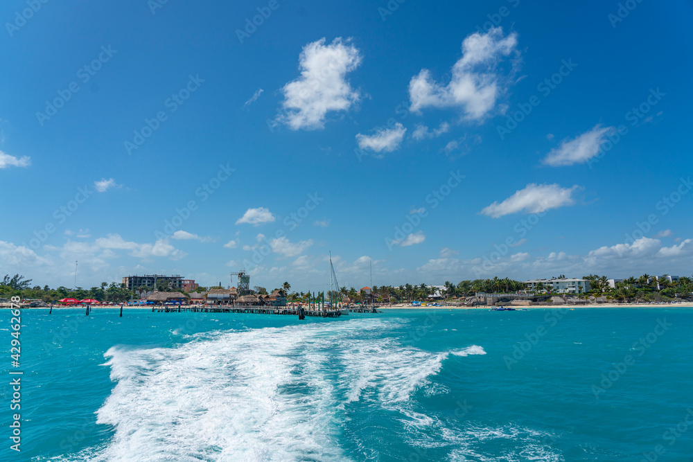 Leaving the pier with turquoise Ocean waters of turtle beach- playa tortugas - at Cancun hotel zone