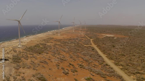 aerial image with drone of the kanoa beach on the island of curacao with the wind turbines photo