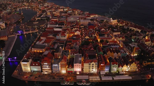 aerial drone image of the city of curacao in the caribbean at night