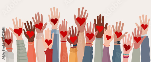 Arms and hands raised. Group of diverse people with heart in hand. Charity donation and volunteer work. Support and assistance. Multicultural and multiethnic community. People diversity