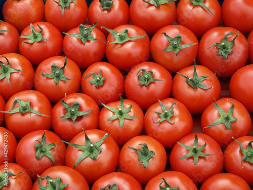 Colorful background of ripe tomatoes