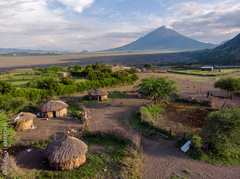 Aerial Drone Shot. Traditional Masai village at Sunset time near Arusha, Tanzania