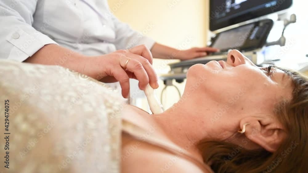 Ultrasound test. Examination of thyroid gland in clinic Ultrasound test. Examination of thyroid gland in clinic