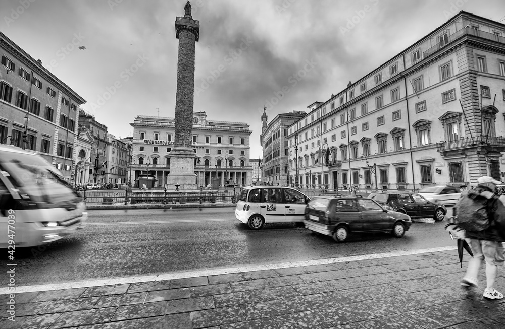 ROME, ITALY - JUNE 2014: Traffic along city streets on a summer day